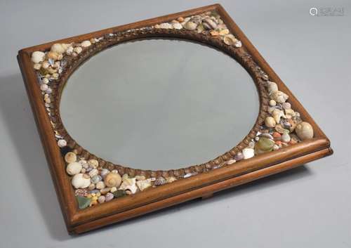 A 19th Century Shell Work Mirror with a Bevelled Circular Mi...