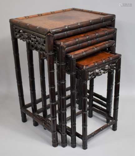 A Chinese Hardwood Nest of Tables, the Supports with Faux Ba...