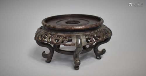 A Chinese Hardwood Carved and Pierced Stand, Raised on Five ...