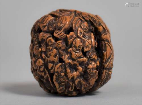 A Chinese Carved Walnut Shell Decorated with Figures and Pag...