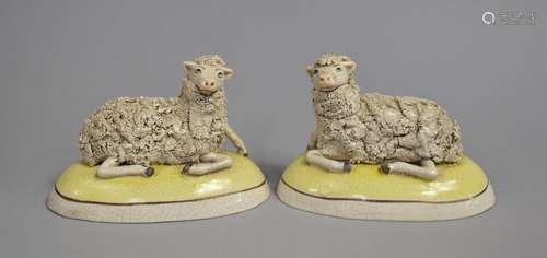 A Pair of Reproduction Staffordshire Figures of Recumbent Sh...