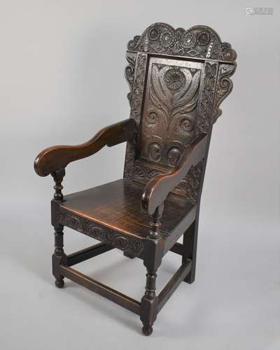 A 18th Century Joined Oak Wainscot Armchair with carved back...