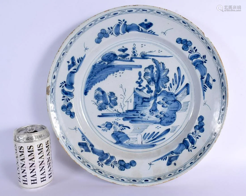 A LARGE 18TH CENTURY DELFT BLUE AND WHITE TIN GLAZED CHARGER...