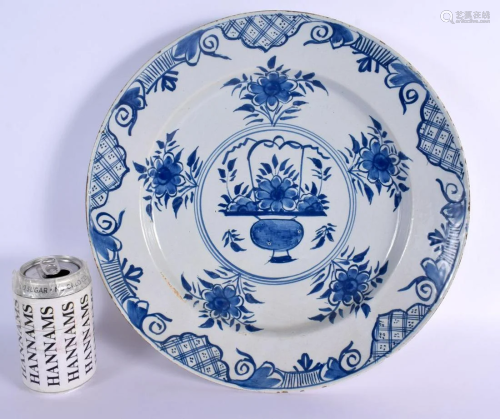 A LARGE 18TH CENTURY DELFT BLUE AND WHITE TIN GLAZED CHARGER...