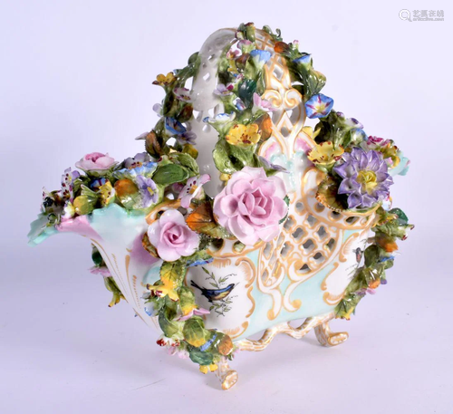 A MID 19TH CENTURY CONTINENTAL PORCELAIN BASKET encrusted al...