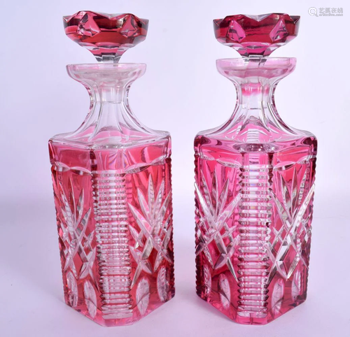 A PAIR OF BOHEMIAN RUBY FLASH DECANTERS AND STOPPERS with st...