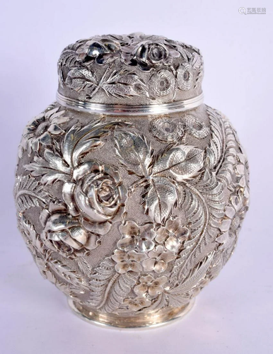 A CHARMING EMBOSSED SILVER TEA CADDY AND COVER decorated in ...