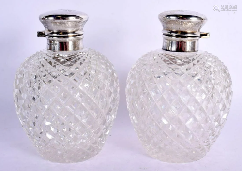 A PAIR OF ANTIQUE SILVER TOPPED CUT GLASS SCENT BOTTLES AND ...