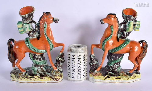 A PAIR OF 19TH CENTURY STAFFORDSHIRE FIGURES OF HORSES model...