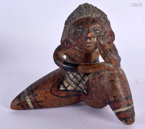 AN UNUSUAL SOUTH AMERICAN TERRACOTTA FIGURE OF A MALE with e...