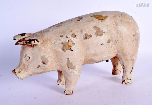 A CHARMING FOLK ART CARVED WOODEN PIG. 24 cm x 12 cm.