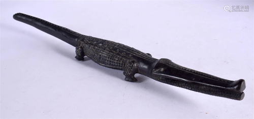 AN EARLY 20TH CENTURY AFRICAN TRIBAL CARVED EBONY CROCODILE....