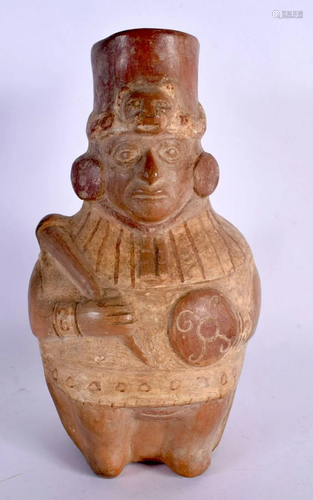 A SOUTH AMERICAN CARVED AND PAINTED TERRACOTTA FIGURE modell...