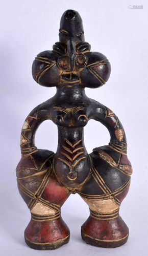 AN UNUSUAL EARLY 20TH CENTURY AFRICAN CARVED AND PAINTED TER...