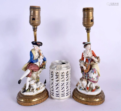 A PAIR OF CONTINENTAL PORCELAIN FIGURAL LAMPS. 29 cm high.