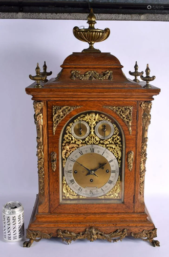 A LARGE ANTIQUE BRONZE MOUNTED OAK MANTEL CLOCK retailed by ...