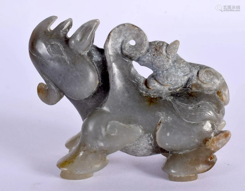 AN EARLY 20TH CENTURY CHINESE CARVED JADE FIGURE OF A RHINO ...