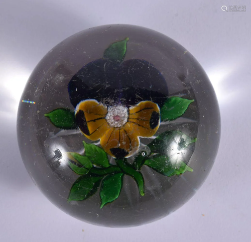 AN ANTIQUE FRENCH SINGLE FLOWER PAPERWEIGHT. 5.5 cm wide.