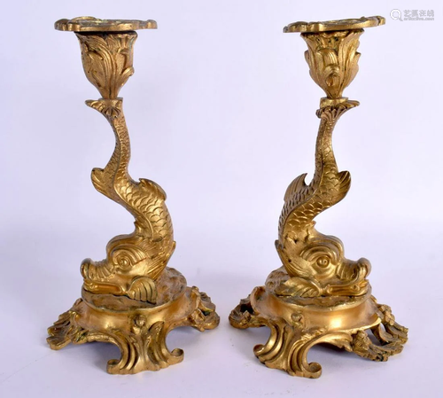 A FINE PAIR OF REGENCY ORMOLU DOLPHIN FORM CANDLESTICKS upon...