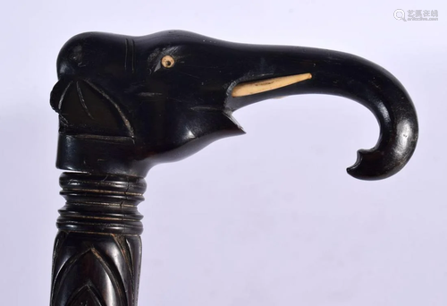 A 19TH CENTURY SRI LANKAN CARVED EBONY AND BONE ELEPHANT WAL...