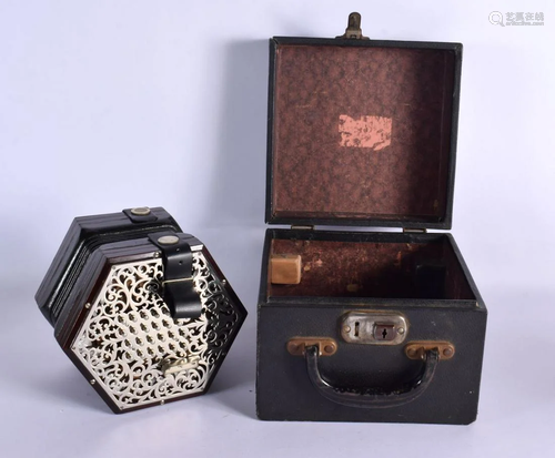 A CASED LACHENAL & CO 48 BUTTON CONCERTINA. Each end 15 ...