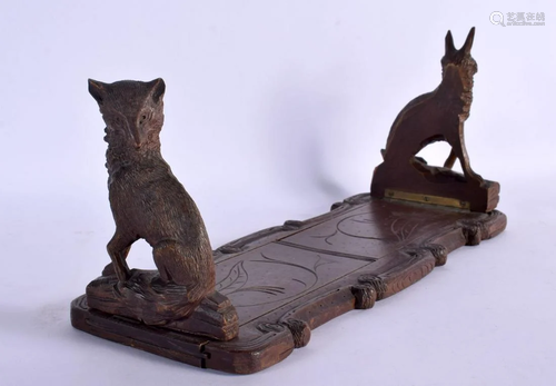 A 19TH CENTURY BAVARIAN BLACK FOREST CARVED WOOD SLIDING BOO...