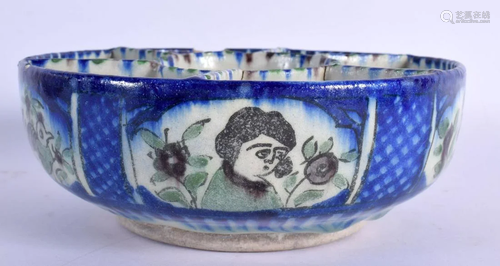 A MIDDLE EASTERN IRANIAN FAIENCE CIRCULAR SERVING BOWL paint...