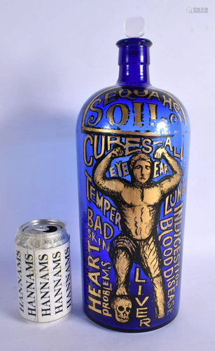 A LOVELY SEQUAHS OIL ADVERTISING BLUE GLASS BOTTLE modelled ...