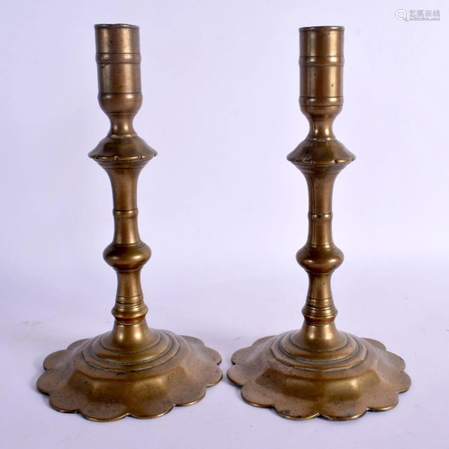 A PAIR OF 18TH CENTURY EUROPEAN BRASS SEAMED CANDLESTICKS up...