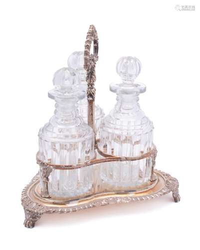 An electro-plated three-division decanter stand: of trefoil ...