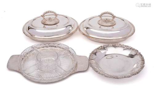 A pair of silver plated entree dishes and covers: of oval ou...