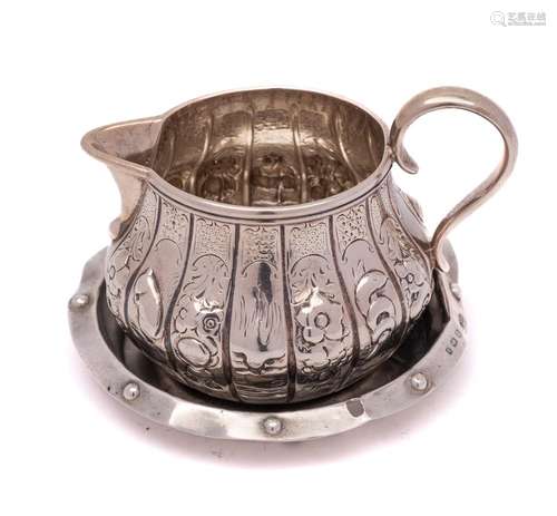 A Victorian silver cream jug, makers mark worn, London,