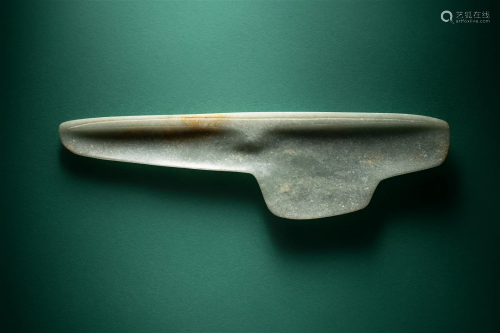 An Olmec Jade Spoon Length 7 5/16 inches (18.5 cm).