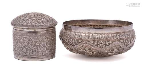 An Indian silver bowl: of circular outline with embossed dec...