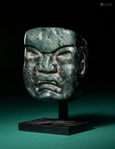 An Olmec Serpentine Maskette Height 2 1/2 inches (6.4 cm).
