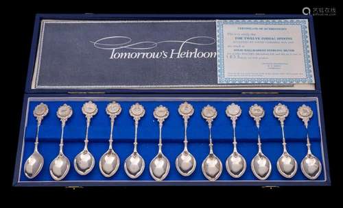 A set of twelve Elizabeth II silver teaspoons with zodiac te...