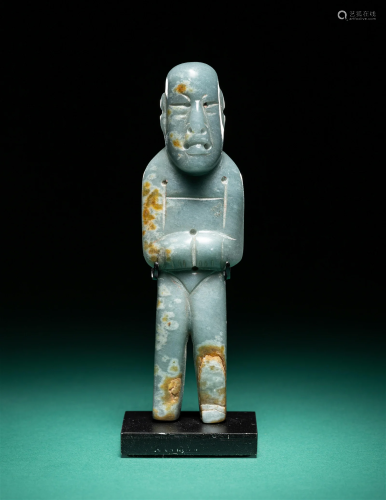An Olmec Jade Standing Figure Height 4 inches (10.16 cm).