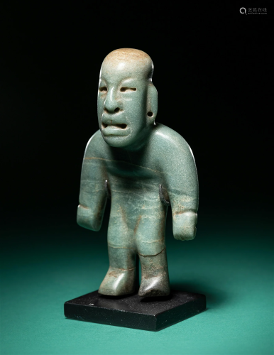 An Olmec Jade Figure Height 4 inches (10.16 cm).