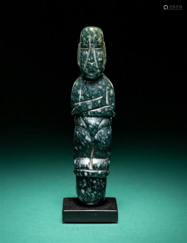 An Olmec Jade Pounding Figure Height 3 19/32 inches (9.14 cm...