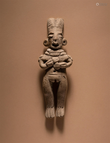 A Michoacan Standing Female Figure Height 4 inches (10.2 cm)...