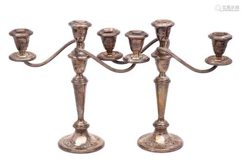 A pair of sterling silver and filled twin branch candelabra,