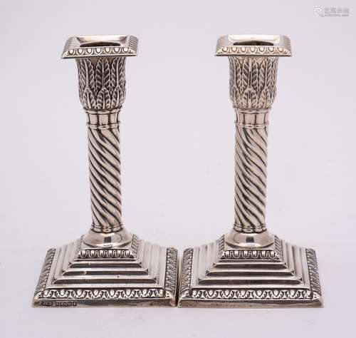 A pair of Victorian silver candlesticks, maker Hawksworth, E...