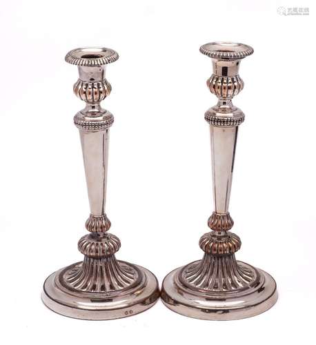 A pair of George III silver plated candlesticks,