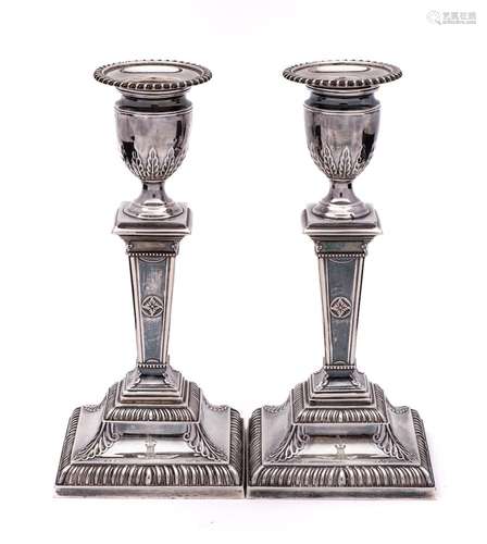 A pair of late Victorian silver candlesticks, maker Thomas B...