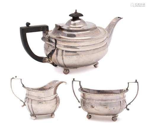 A George V silver three-piece tea service, maker C S Harris ...