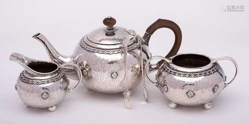 A George V hammered silver three-piece tea service, maker Li...