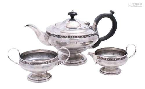 A George V silver pedestal three-piece tea set, maker Robert...