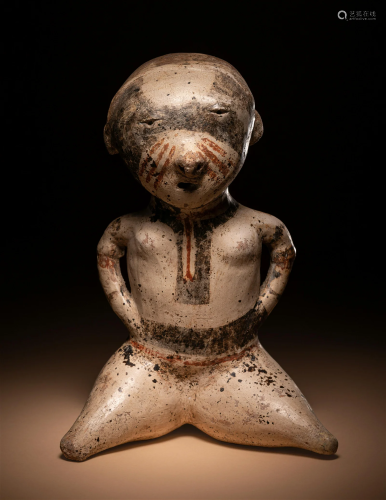 A Nayarit Seated Female Height 8 5/16 inches (30 cm).