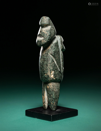 A Mezcala Diorite Standing Figure with an Infant Height 3 3/...