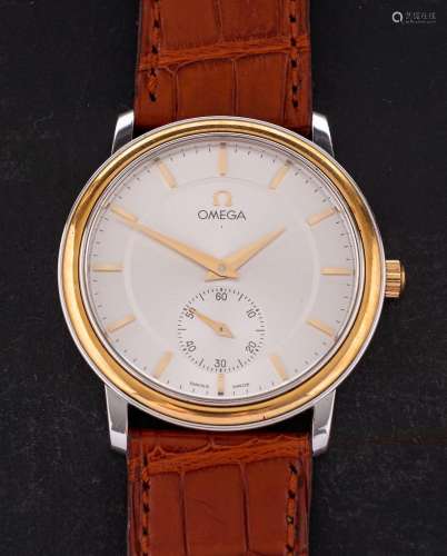 An 18ct gold and steel manual wind Omega wristwatch: the rou...